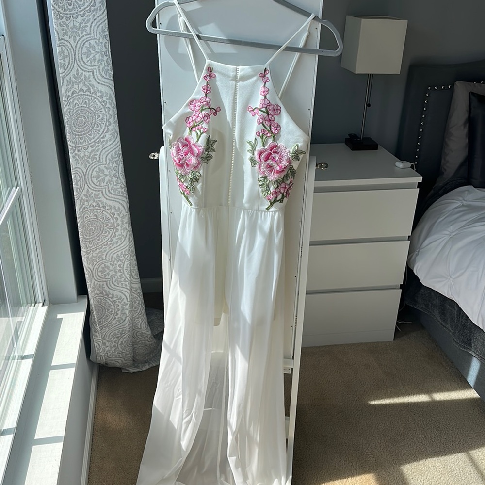 White and floral pink jumpsuit with shorts and a skirt